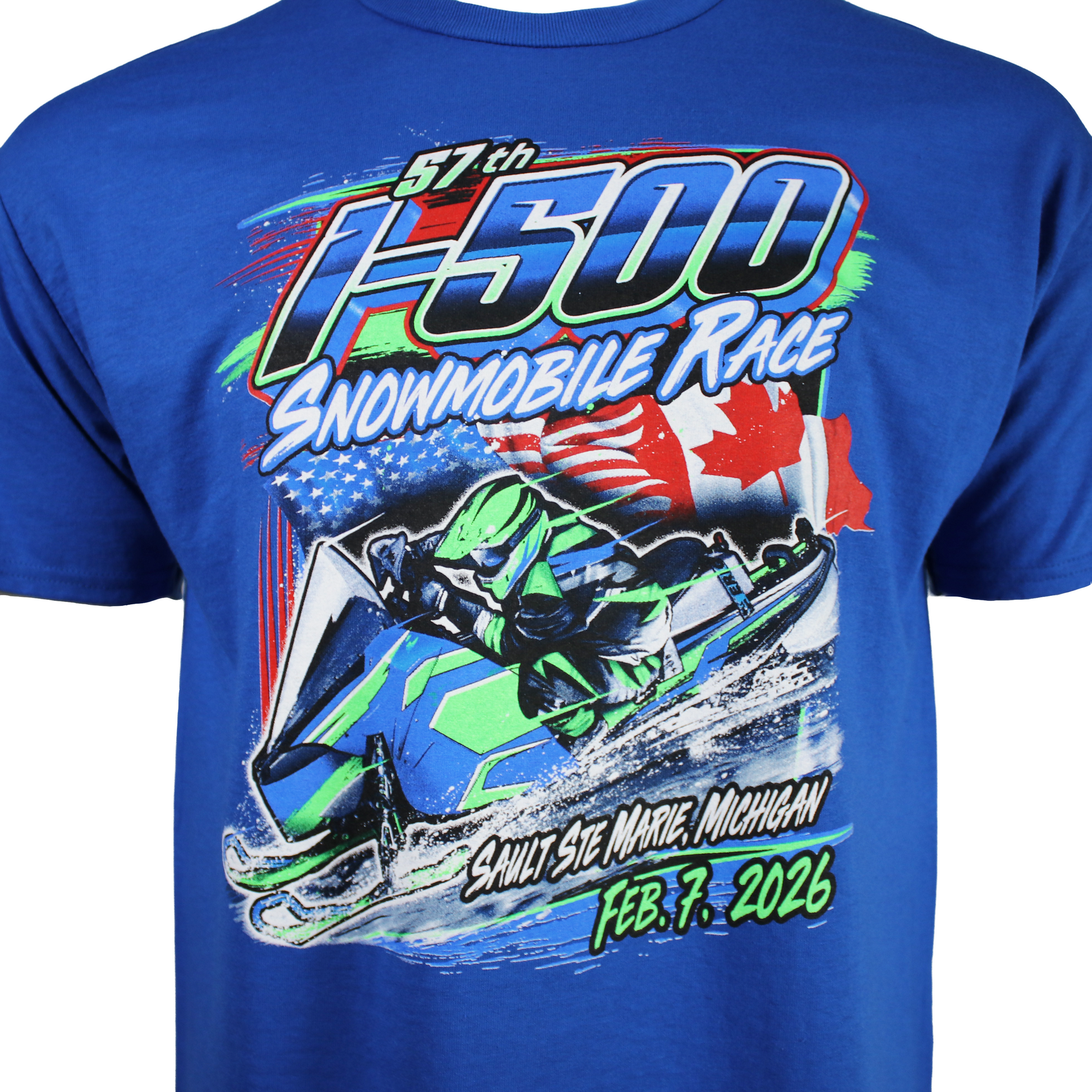 Close up of a royal blue t-shirt with a snowmobile race graphic on the front with the text 'I-500 snowmobile Race, Sault Ste. Marie, Michigan, February 7th, 2026'.