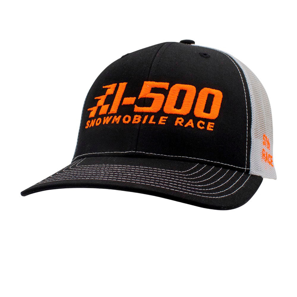Black and white cap with orange text 'I-500 Snowmobile Race' on front.