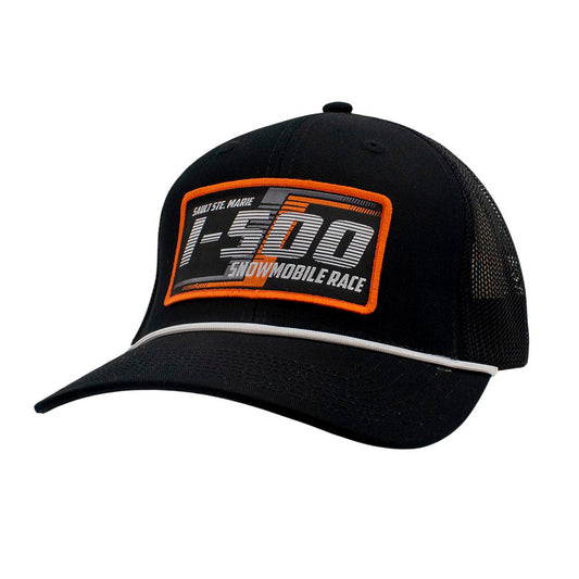 Black cap with orange and grey I-500 patch on the front and a white rope across the bill.